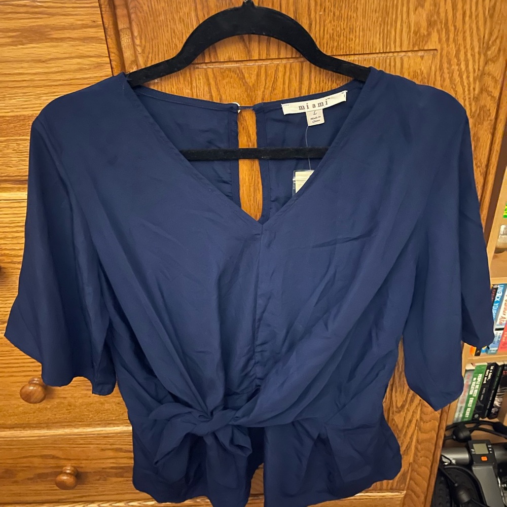 Francesca’s Navy Blue Blouse with tie front. NWT.